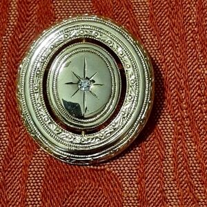 AVON Gold Tone Oval Spinner Starburst Rhinestone Brooch Pin Signed RARE FIND